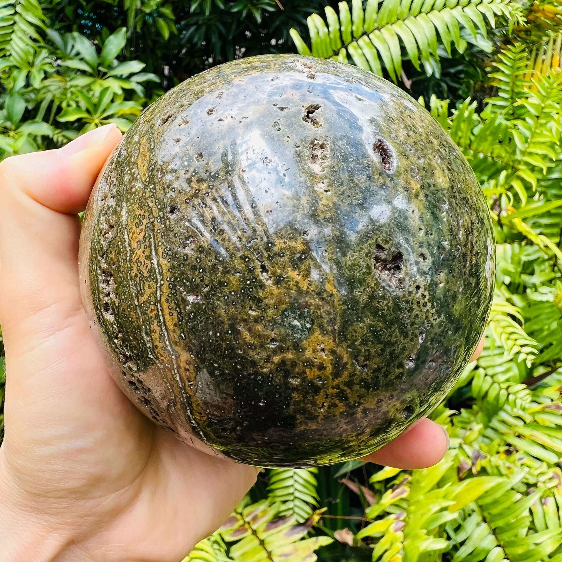 Color detail of green Ocean Jasper polished sphere, showing subtle veining, sourced from Sofia, Madagascar.