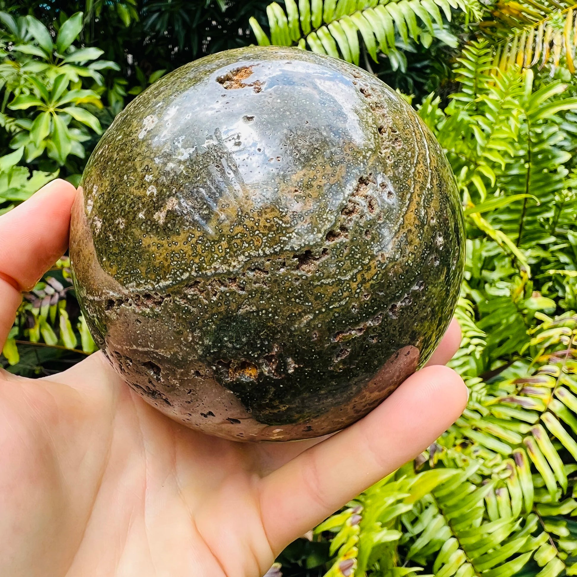Top angle of Ocean Jasper polished sphere, sourced from Sofia, Madagascar, drawn on for Emotional Healing and Stress Relief.