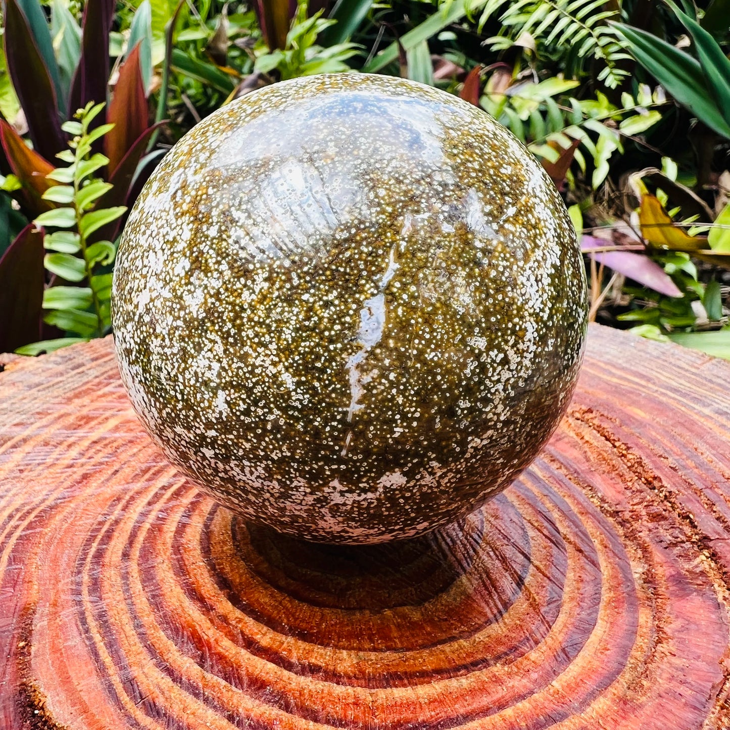 Up-close view of Ocean Jasper polished sphere, showing natural sheen.