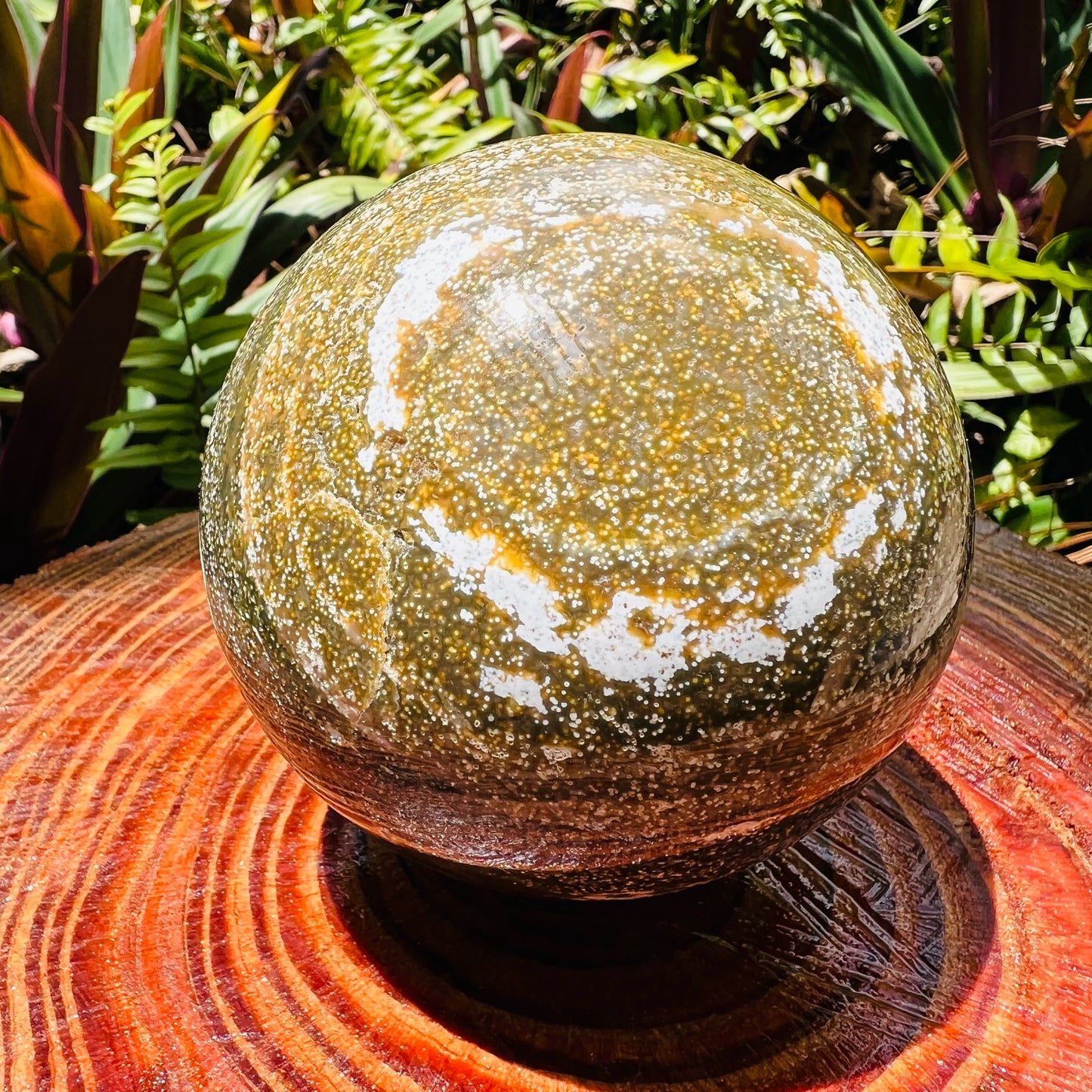 Overhead angle of Grade AA green Ocean Jasper polished sphere, Madagascar-sourced, for Emotional Healing.