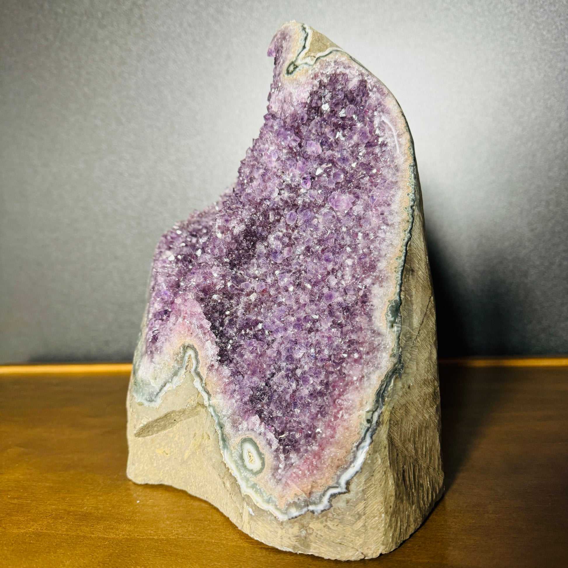 Side-on view of purple Amethyst raw geode, showing natural patina, Uruguay-sourced.