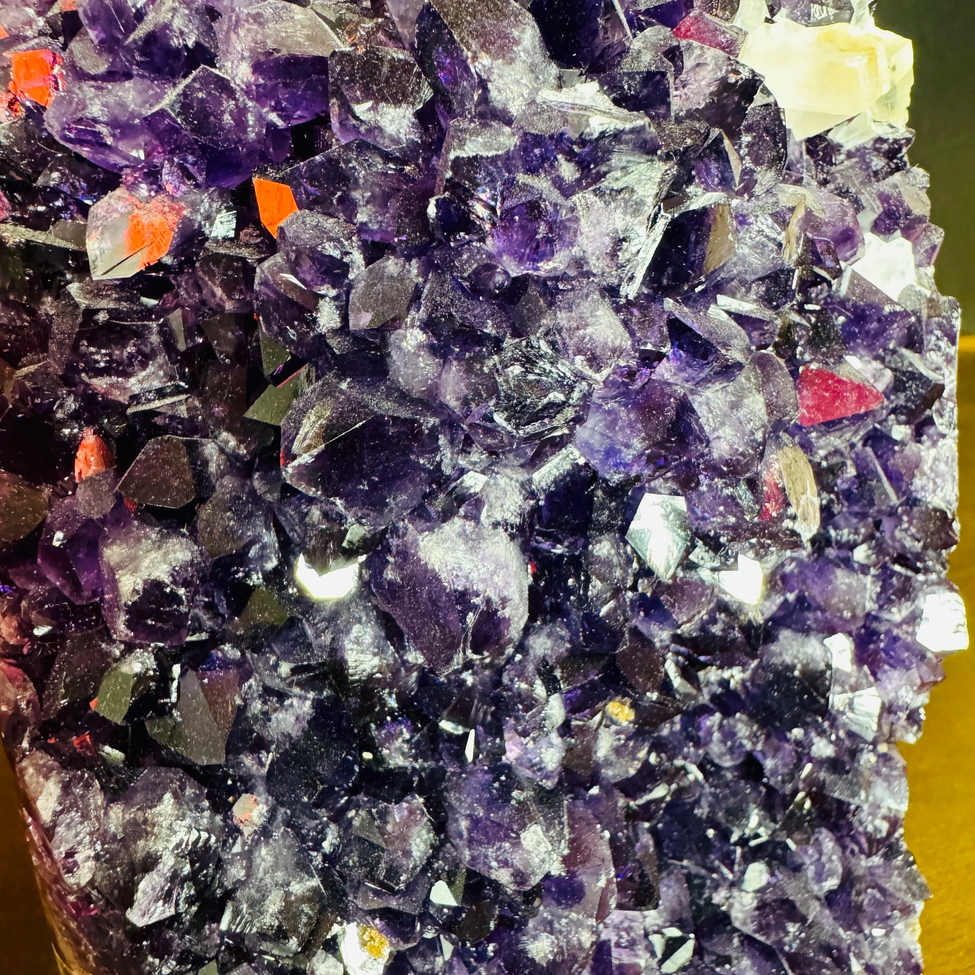 Grade aa amethyst geode held in hand for size reference