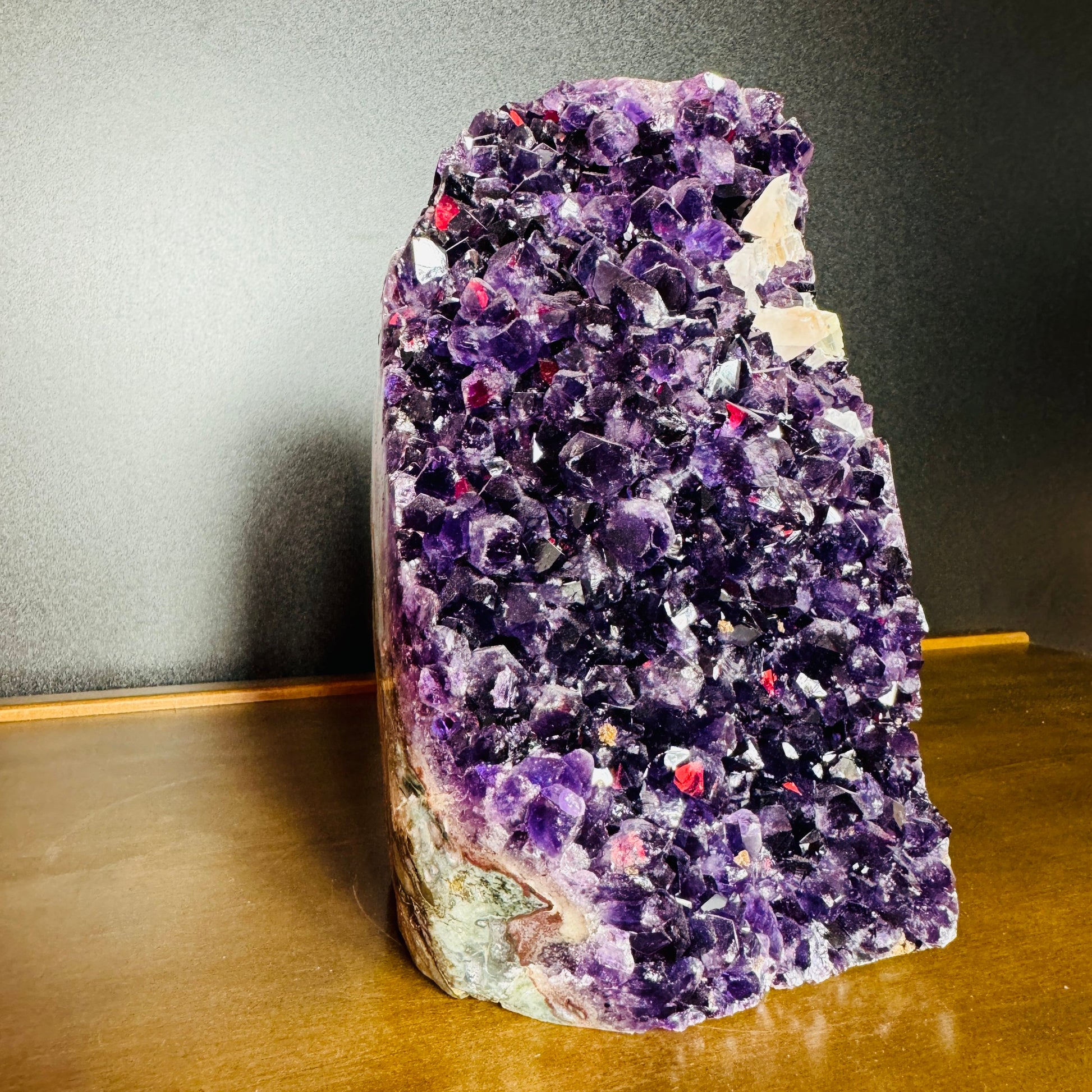 Side perspective of Amethyst raw geode, showing natural sheen.