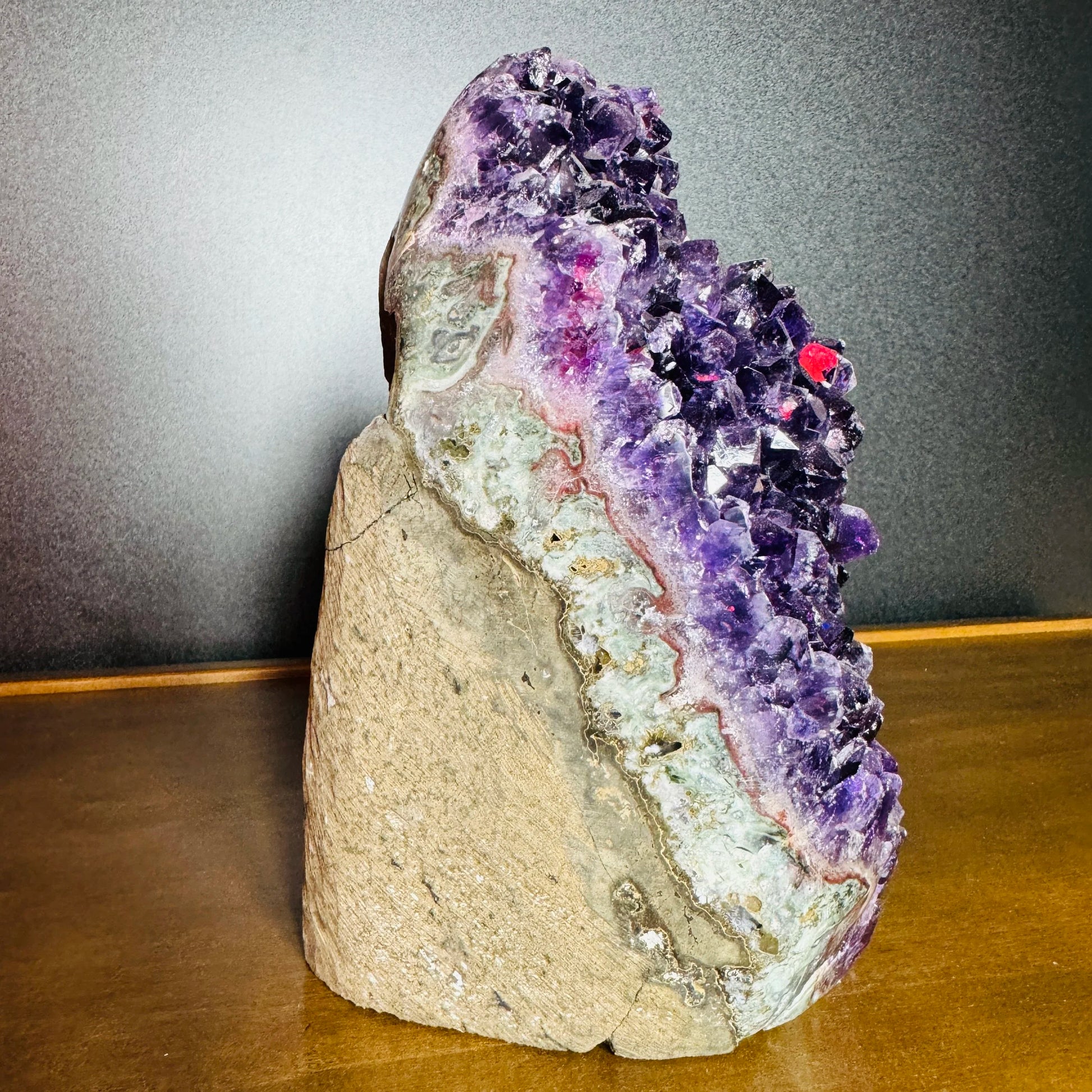 Underside view of Amethyst raw geode, traditionally used for Stress Relief and Sleep, showing natural form.