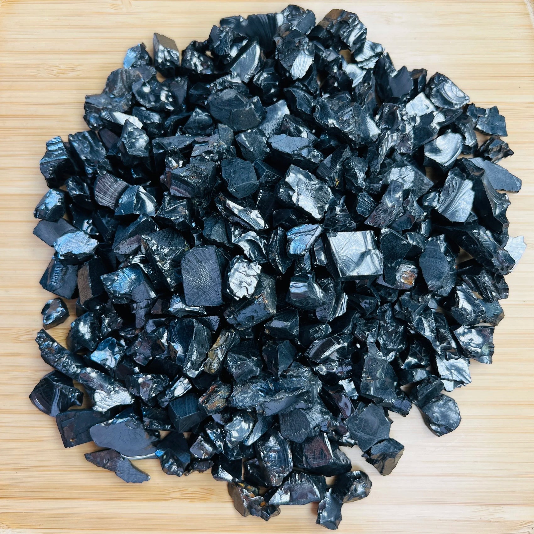 Texture-level view of black Shungite raw stone, showing open form.