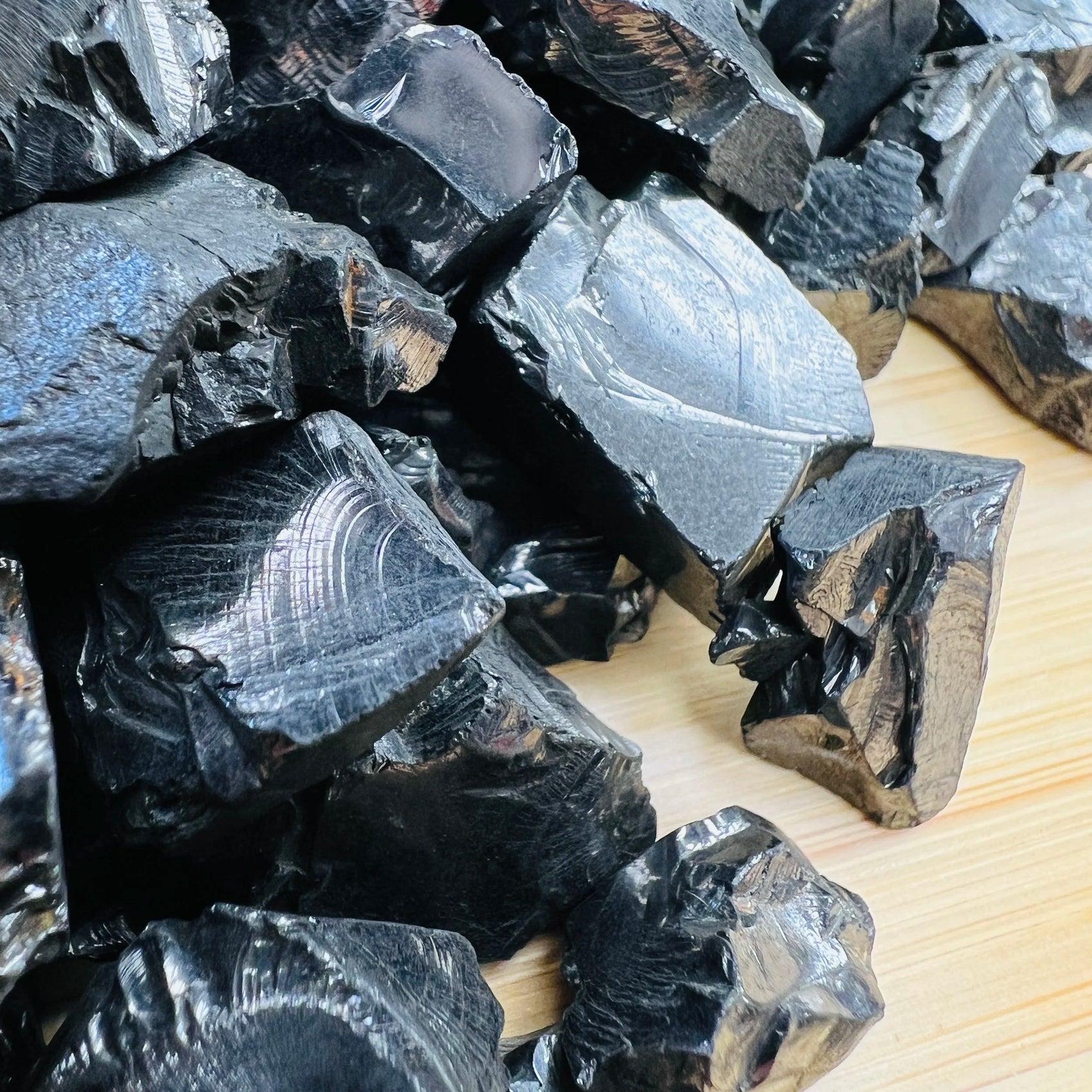 Held in hand, a single Shungite raw stone Russia-sourced.