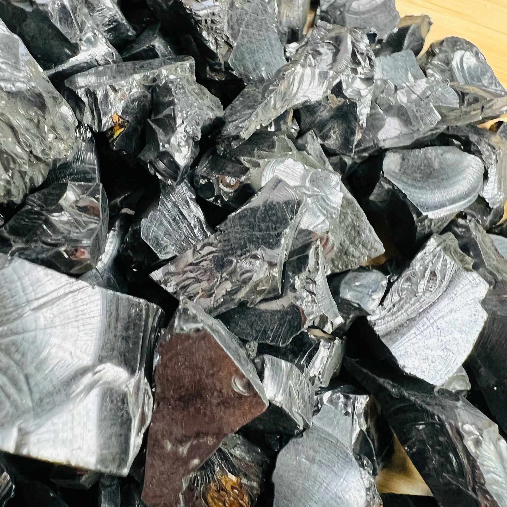 Underside view of Shungite raw stone, for Protection and Cleansing, showing natural variation.