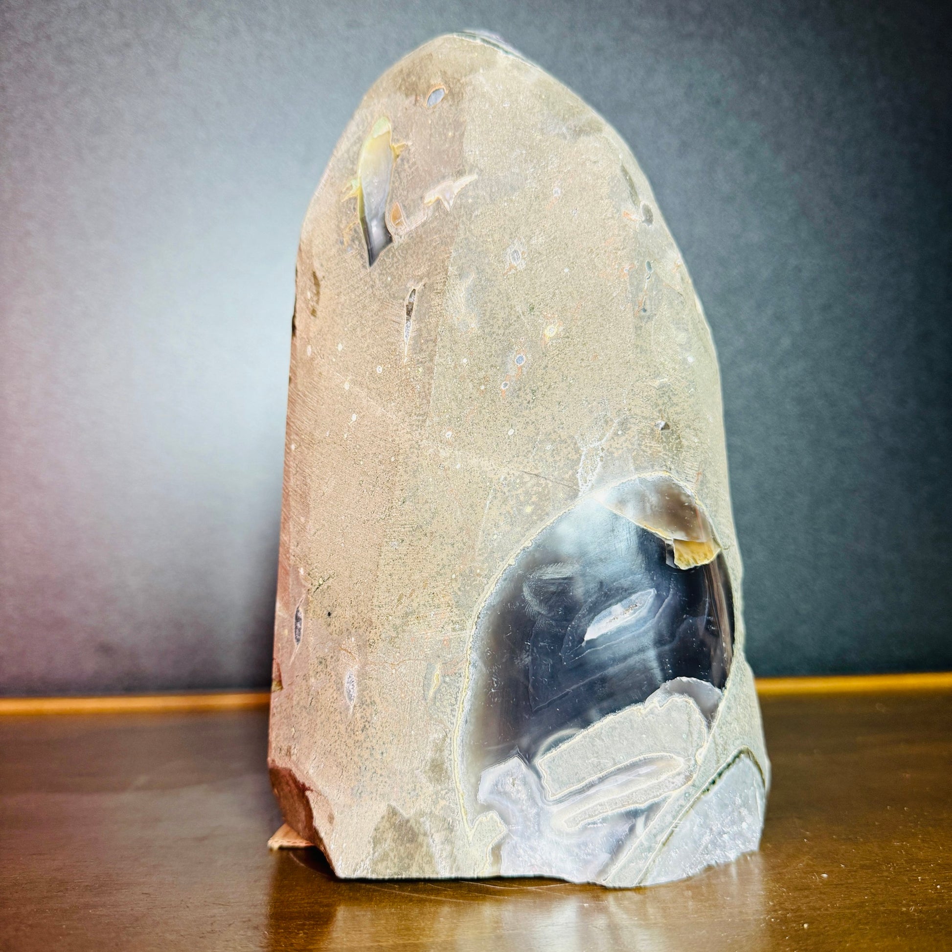 Grade aa amethyst geode held in hand for size reference