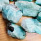 Lateral view of Amazonite raw stone, hand-selected from Amboasitra, Madagascar, drawn on for Stress Relief and Emotional Healing.