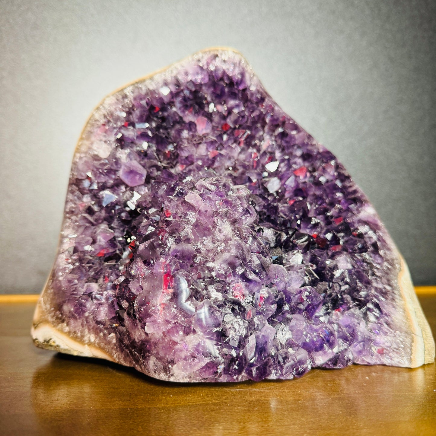 Magnified detail of purple Amethyst raw geode, worked with for Stress Relief and Sleep, showing natural sheen.