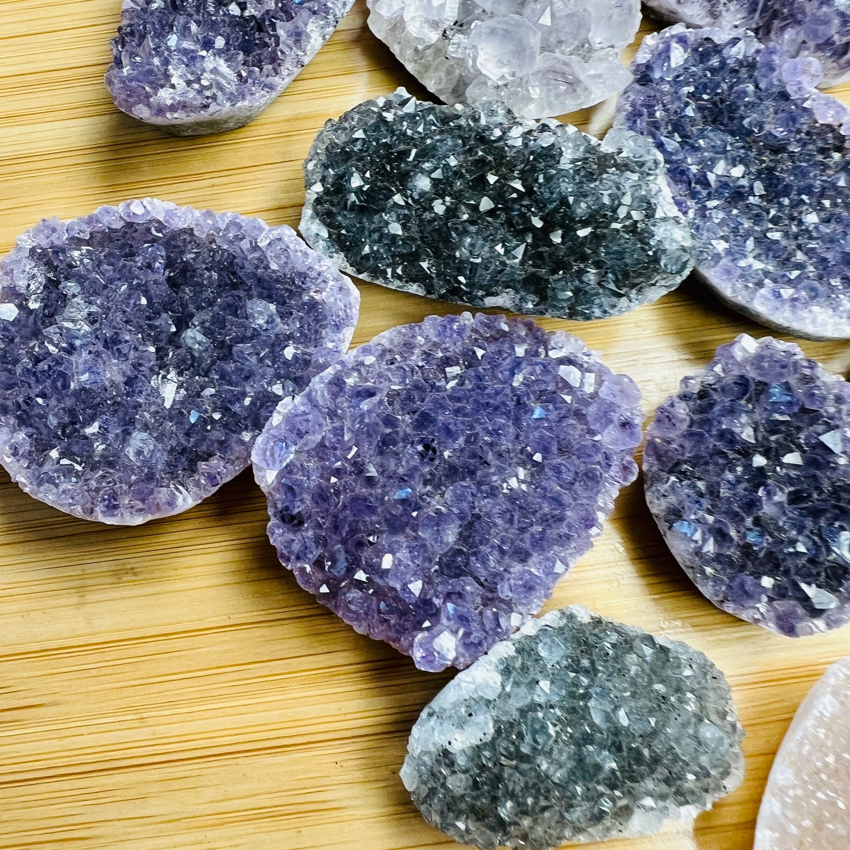 Grade a amethyst raw held in hand for size reference