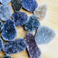 Bird's-eye view of Amethyst raw cabochon, showing natural form.