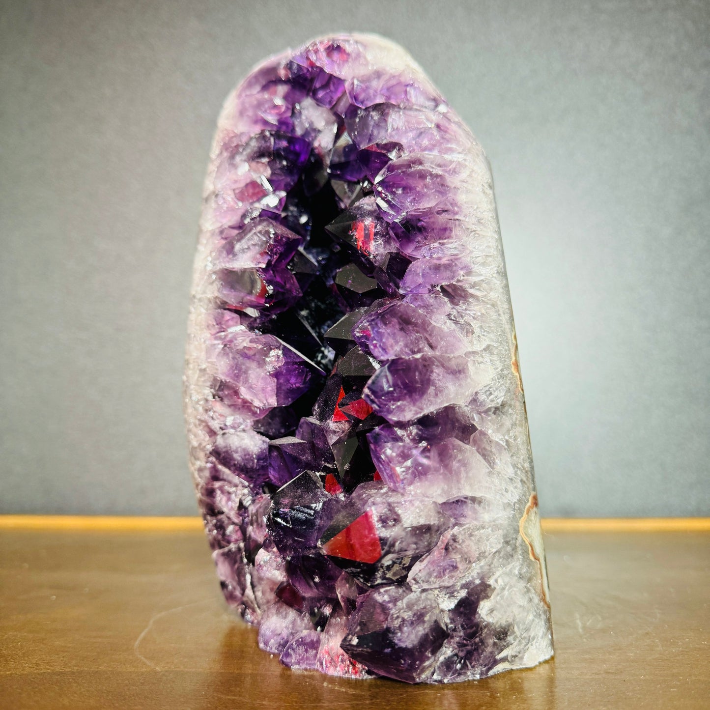 Held in hand, a Amethyst raw geode associated with Stress Relief.
