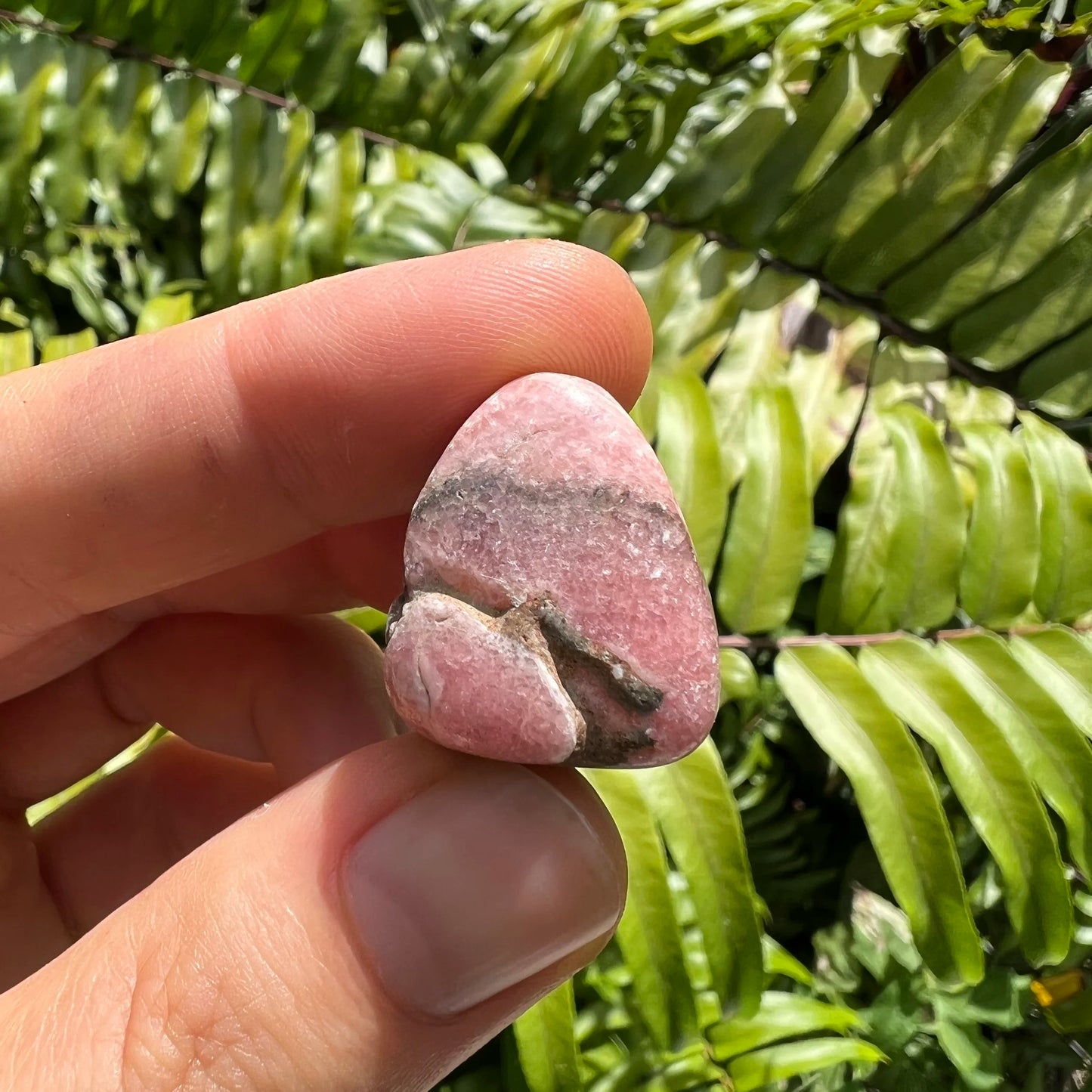 Full profile of Grade A Rhodochrosite tumbled stone ready to ship from Beyond Bohemian