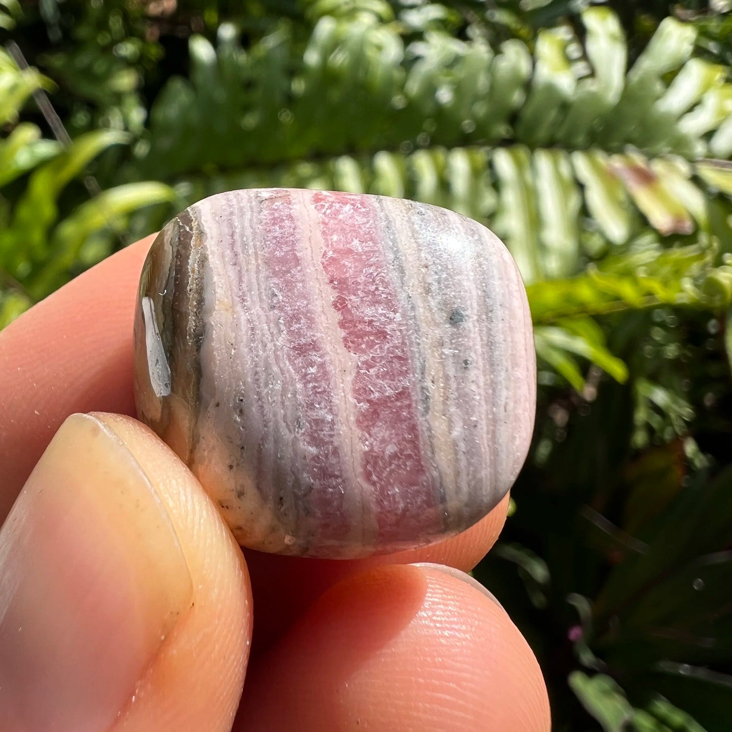 Full profile of Grade A Rhodochrosite tumbled stone ready to ship from Beyond Bohemian