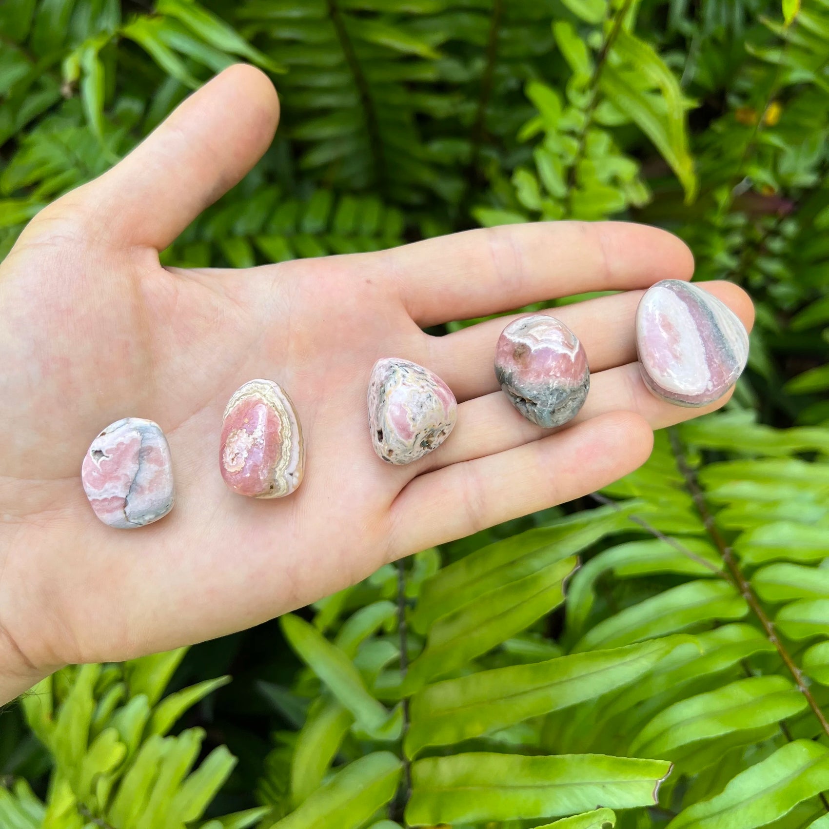 Full profile of Grade A Rhodochrosite tumbled stone ready to ship from Beyond Bohemian
