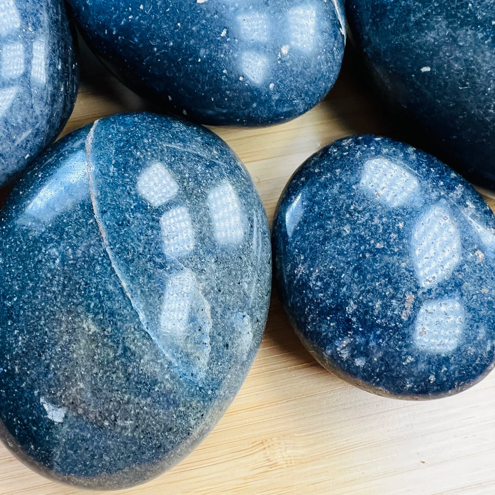 Profile shot of Lazulite palm stone, drawn on for Intuition and Meditation.