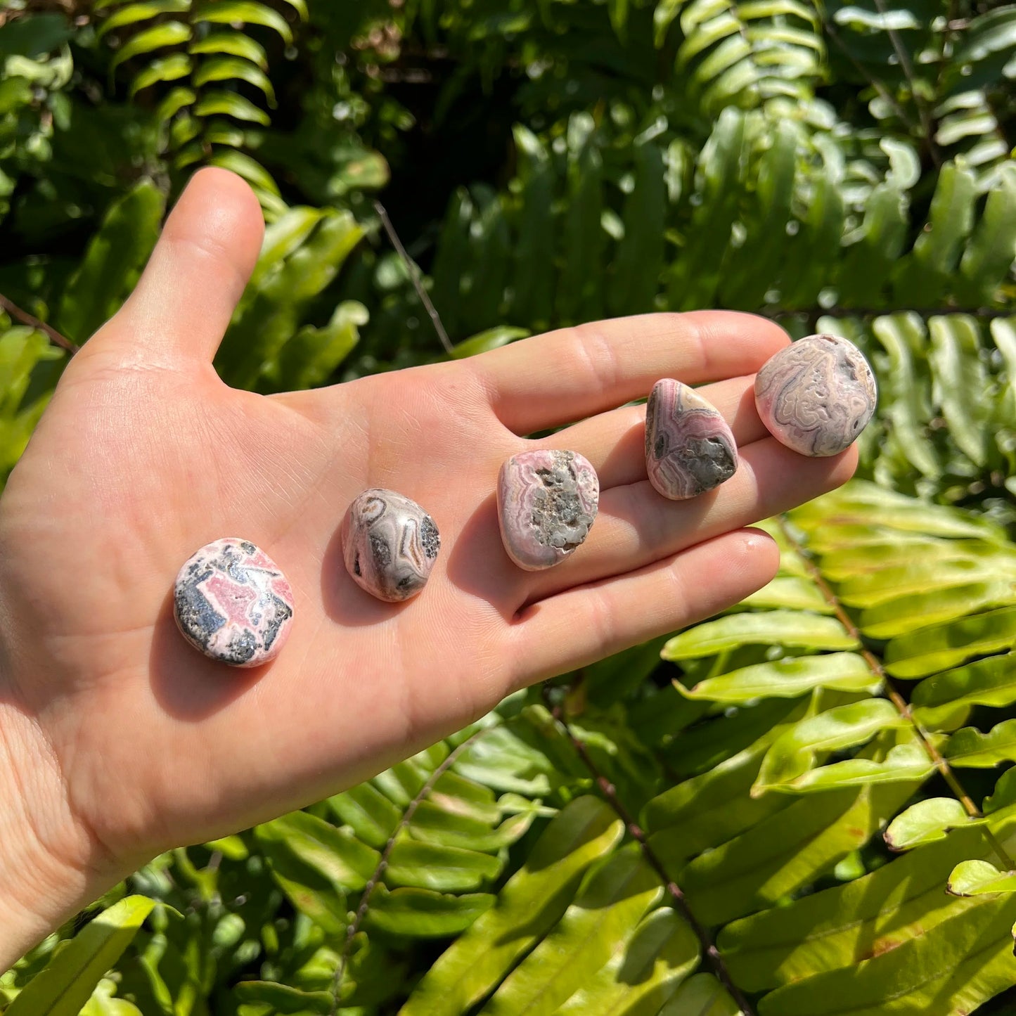 Full profile of Grade A Rhodochrosite tumbled stone ready to ship from Beyond Bohemian