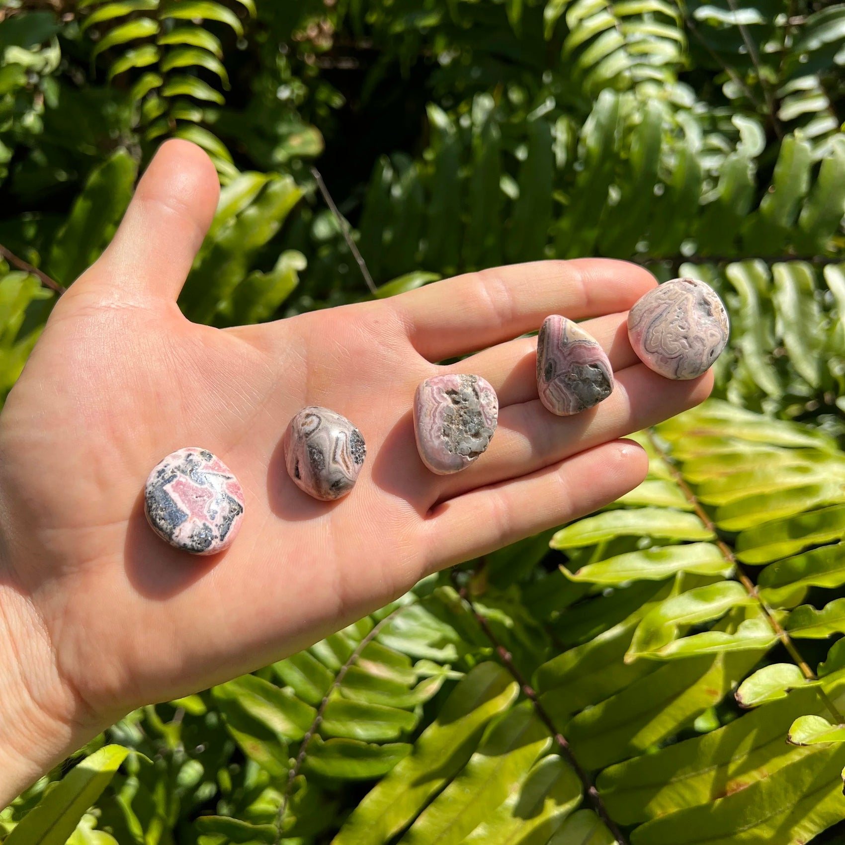 Full profile of Grade A Rhodochrosite tumbled stone ready to ship from Beyond Bohemian