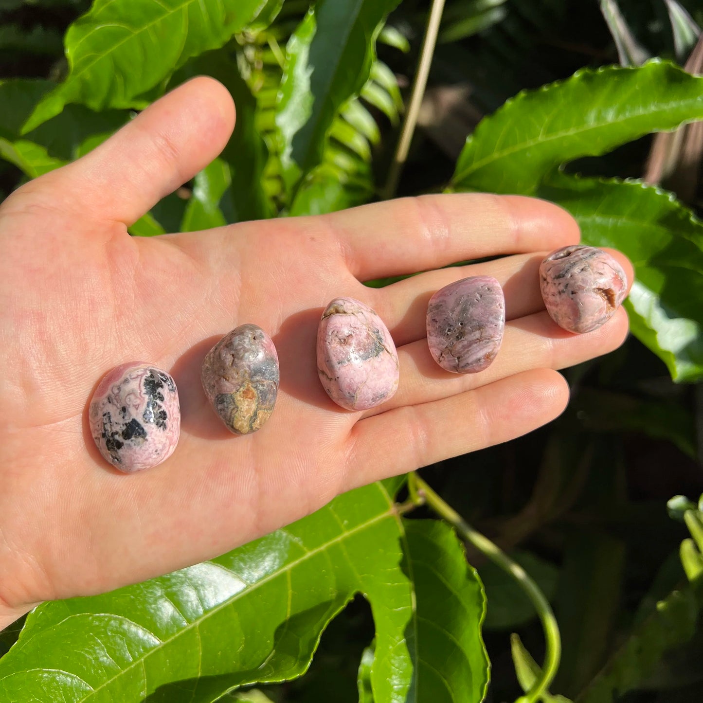 Full profile of Grade A Rhodochrosite tumbled stone ready to ship from Beyond Bohemian