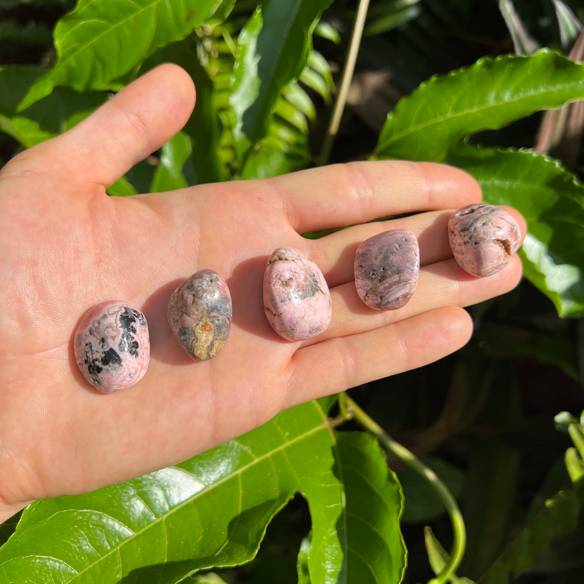 Full profile of Grade A Rhodochrosite tumbled stone ready to ship from Beyond Bohemian