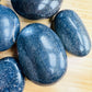 Near view of Lazulite palm stone, from Madagascar, showing natural texture.