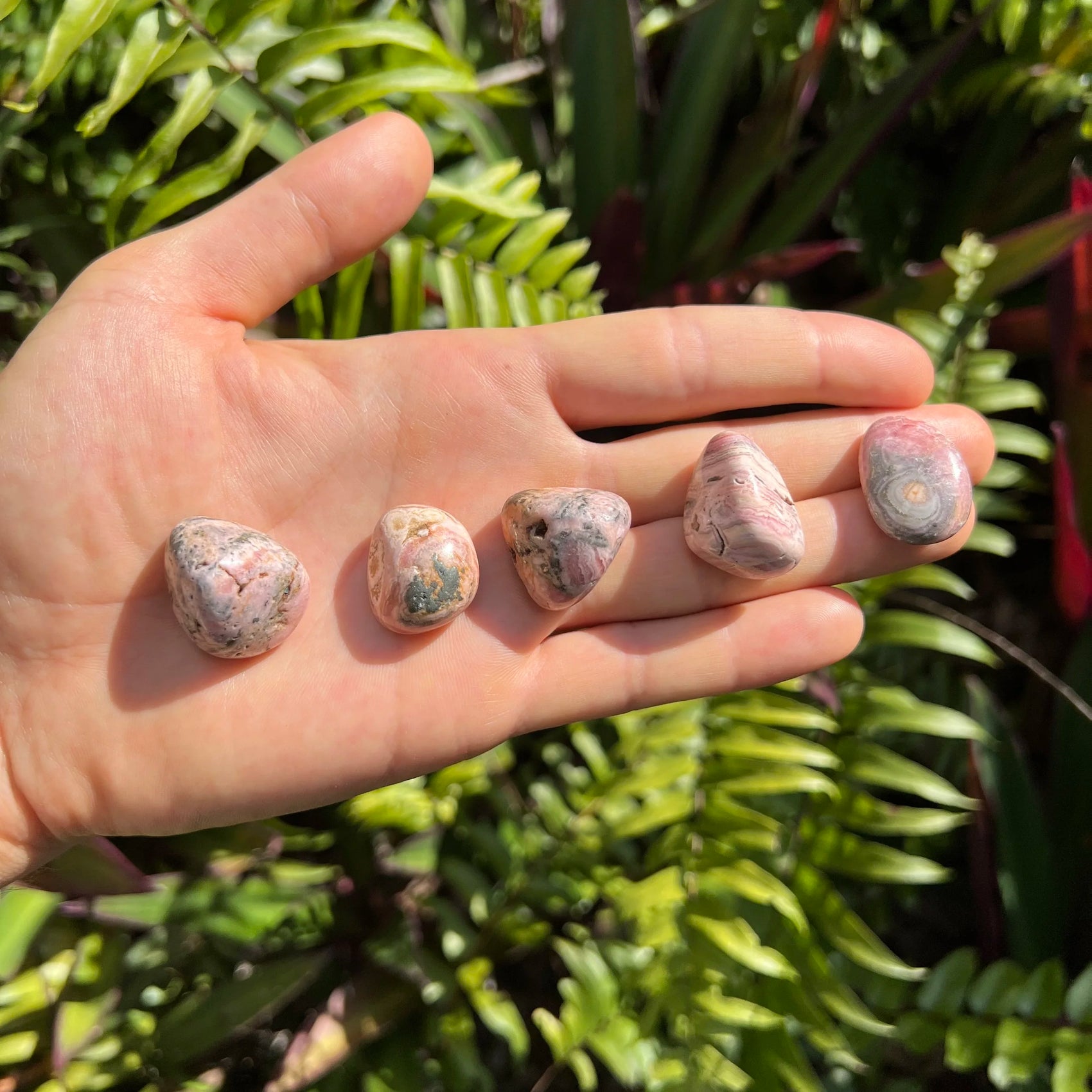 Full profile of Grade A Rhodochrosite tumbled stone ready to ship from Beyond Bohemian