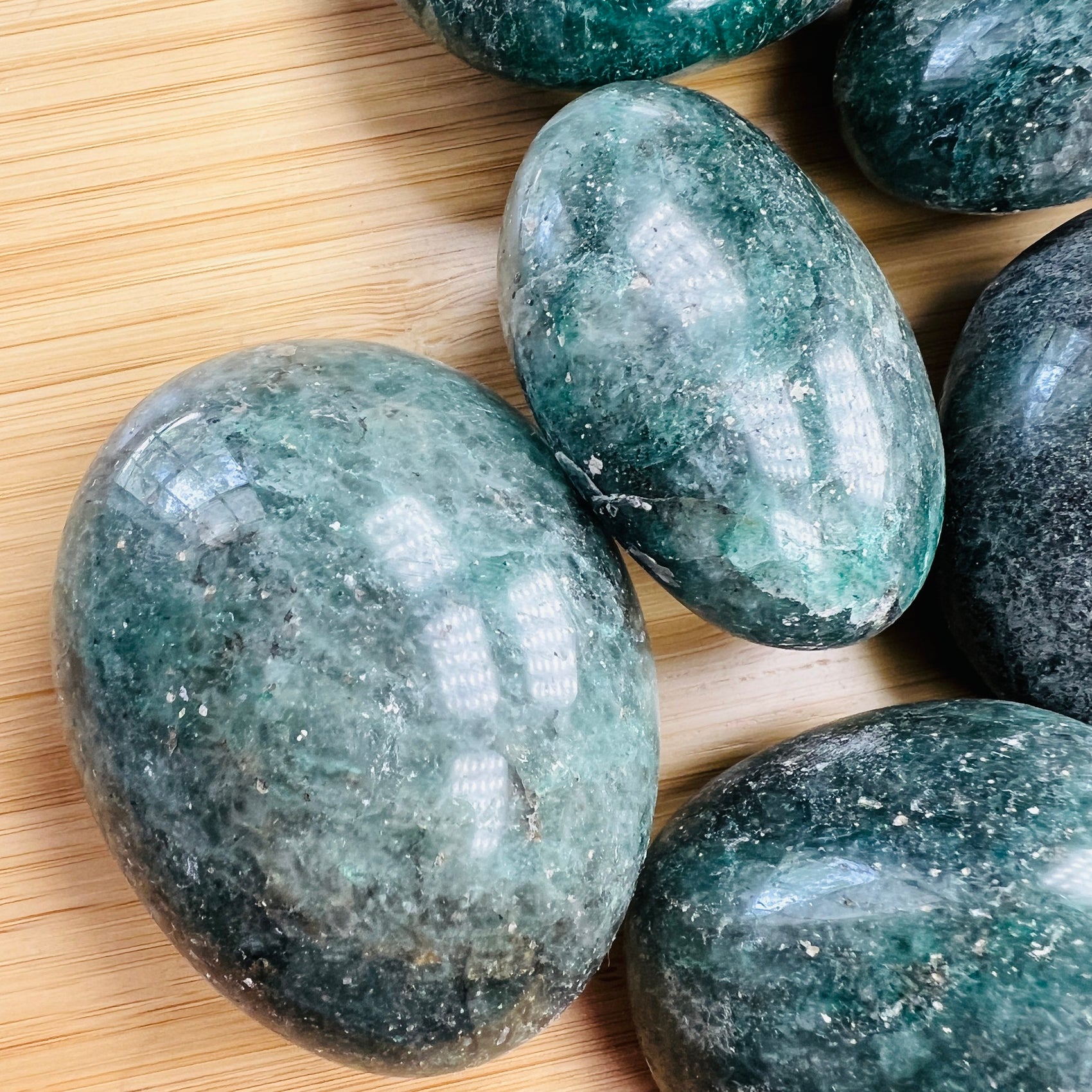 Lateral view of Fuchsite palm stone, Madagascar-sourced.