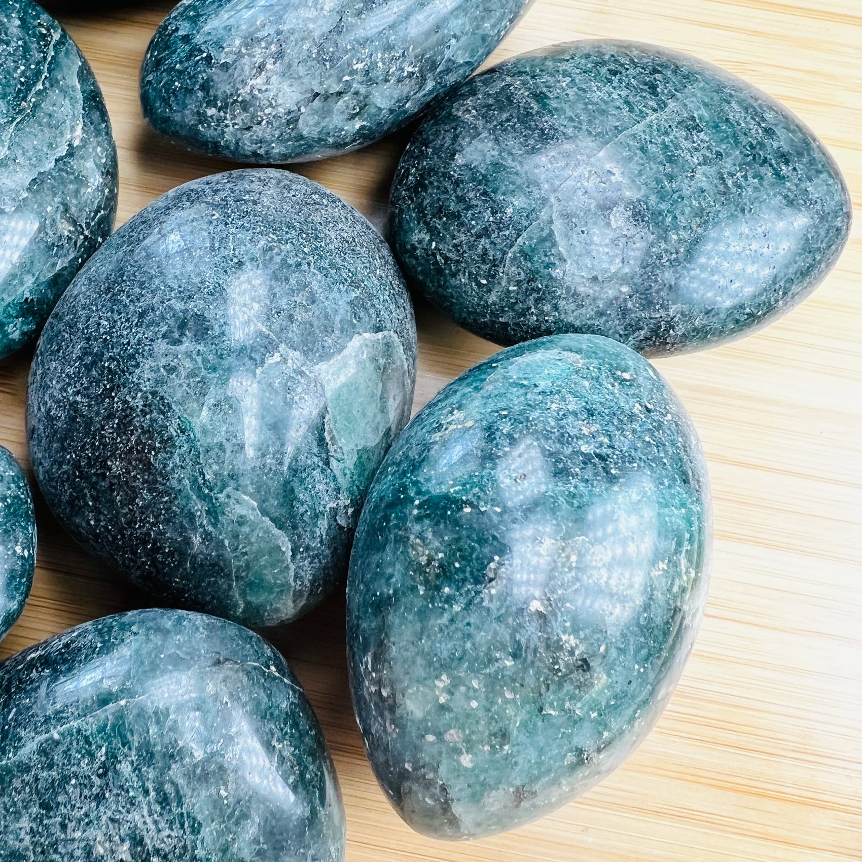Tight crop of Grade AA Fuchsite palm stone, showing color depth.