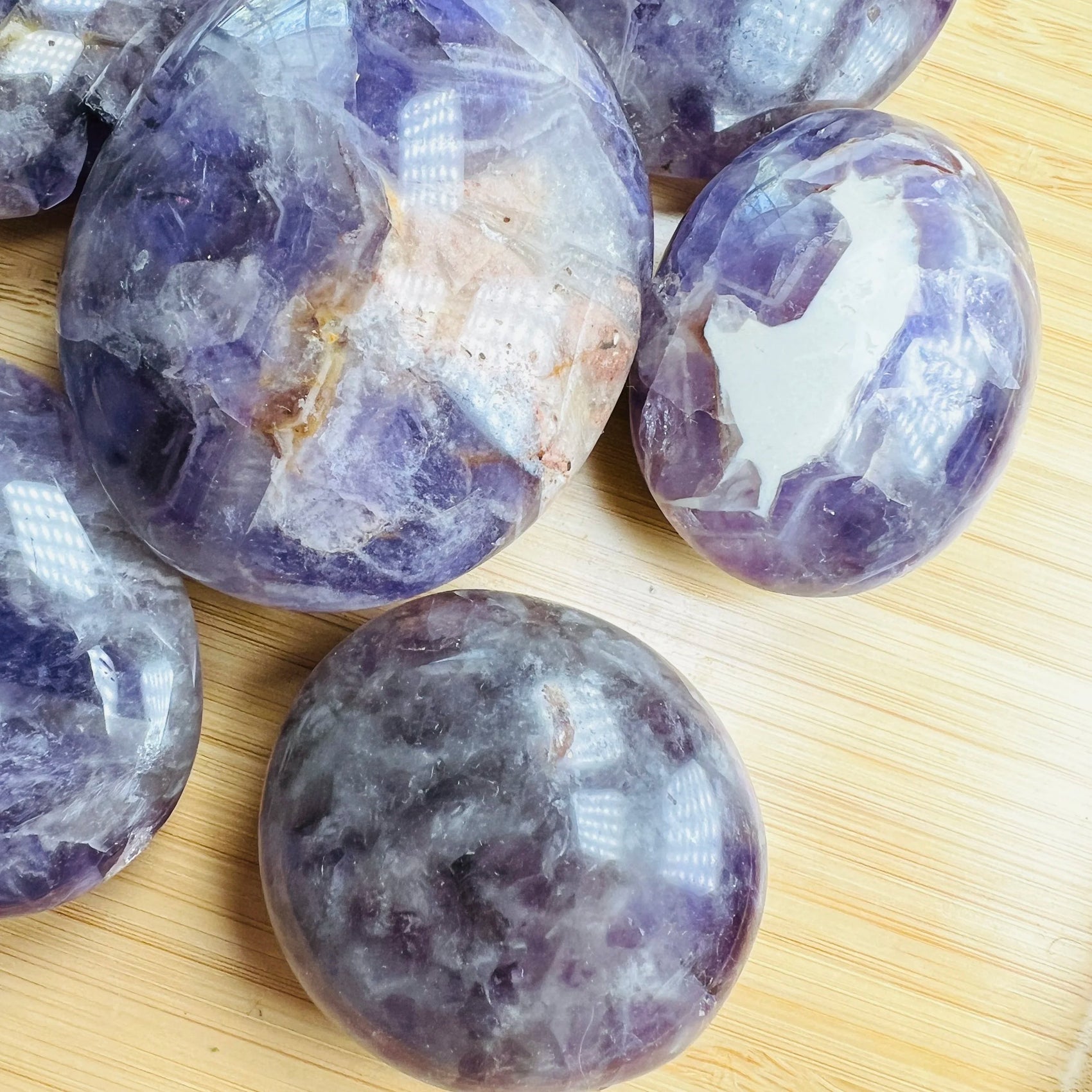 Top-side view of Chevron Amethyst palm stone, from Madagascar.