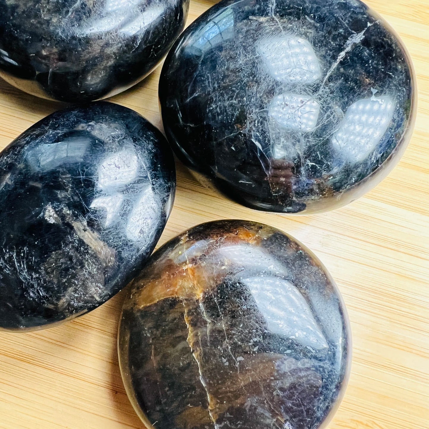Alternate side of blue Iolite palm stone, showing subtle veining.