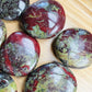 Opposite side of Grade AA Dragon Bloodstone palm stone, sourced from South Africa.