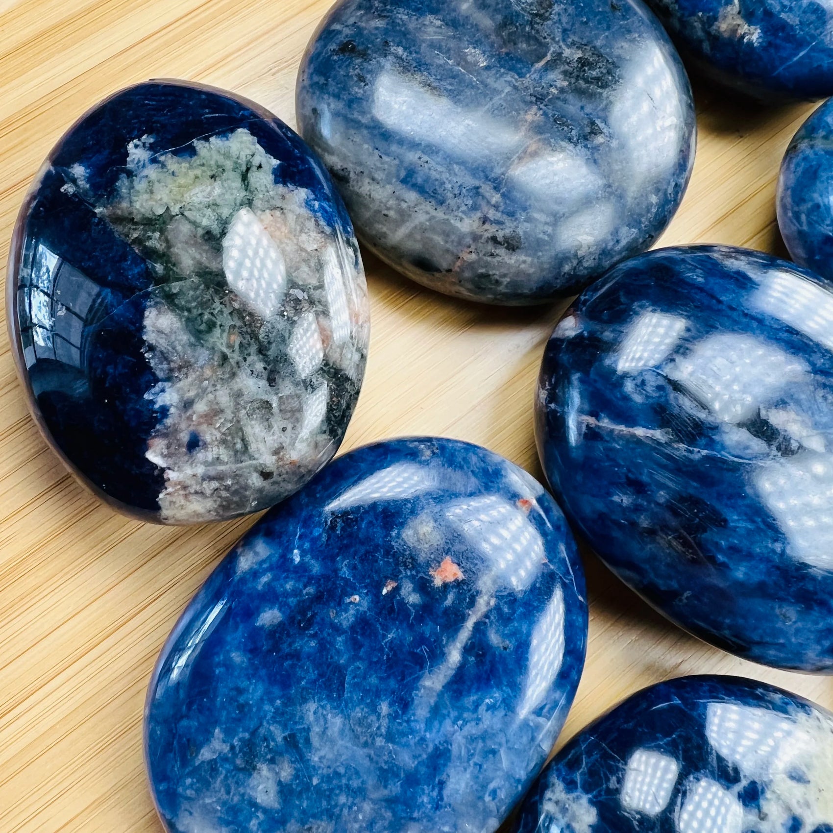 Edge-on view of Grade AA Sodalite palm stone, from Namibia.