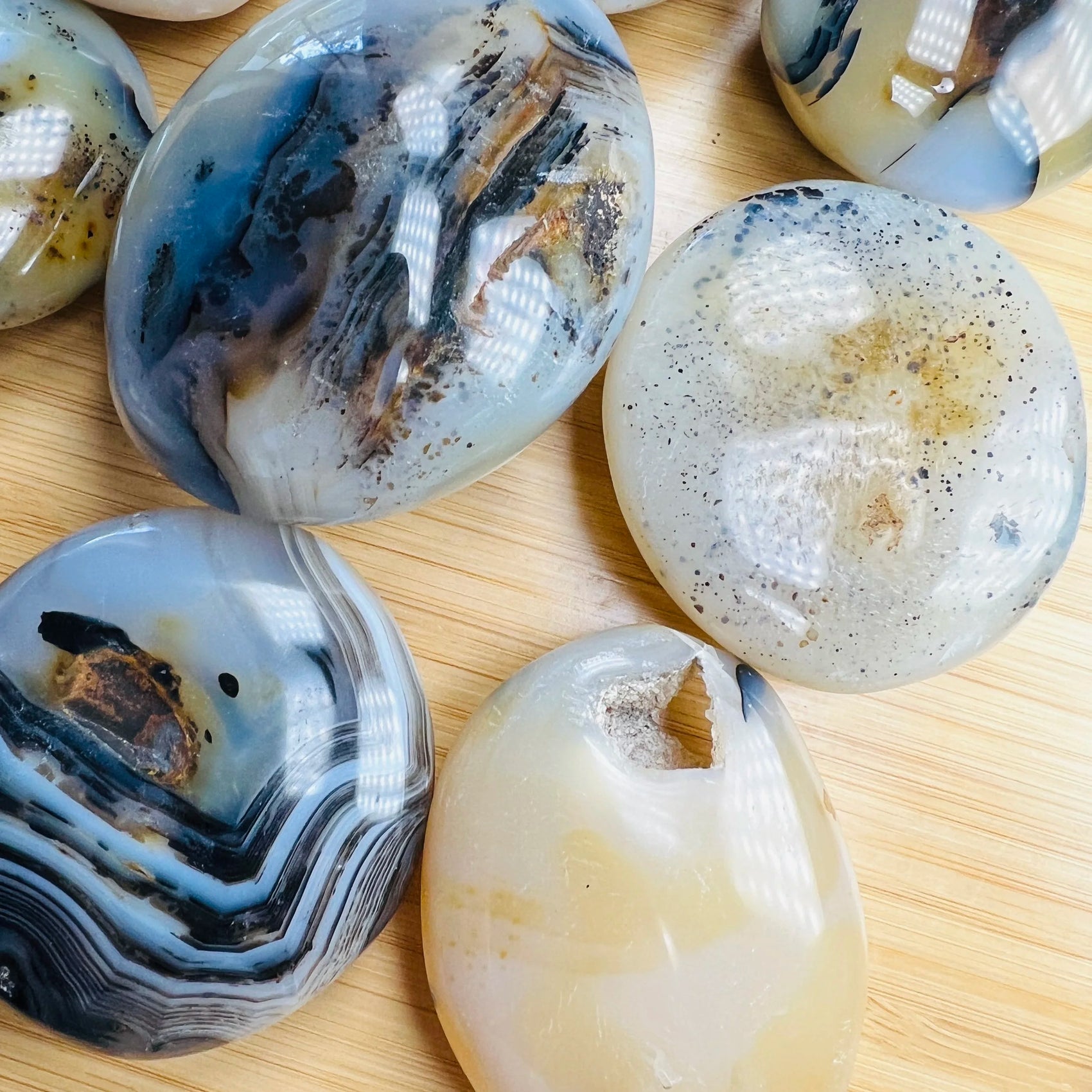 Top-side view of Dendritic Agate palm stone, hand-selected from Boeny, Madagascar, showing natural inclusions.