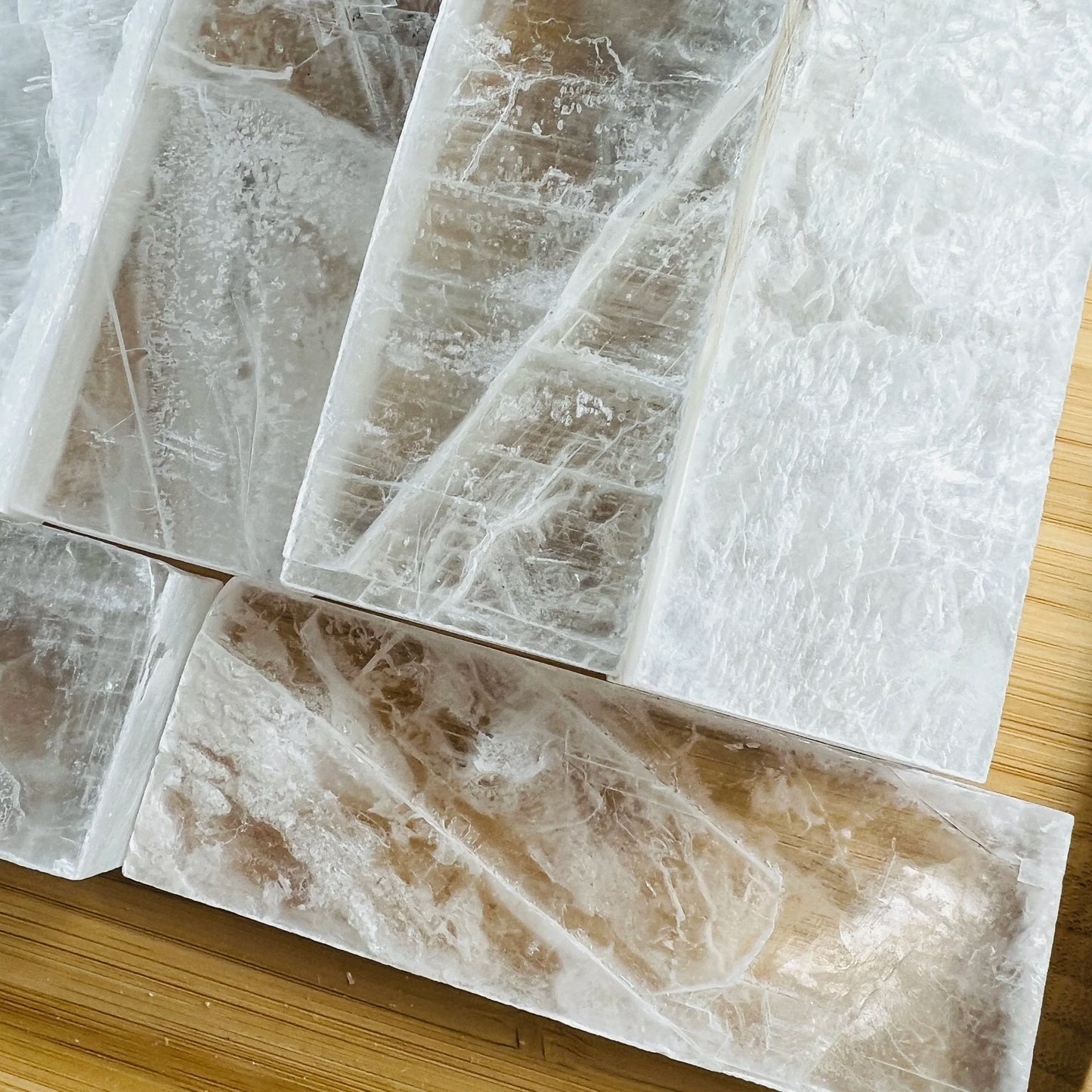 Detail shot of Grade AAA Selenite raw crystals under natural light