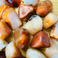 Full profile of Grade AA Carnelian tumbled stone ready to ship from Beyond Bohemian