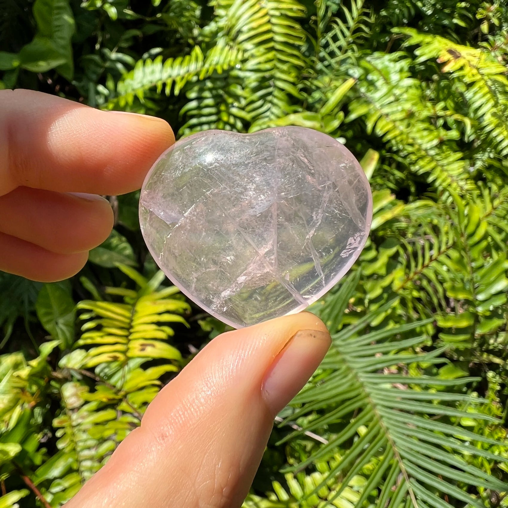 Underside view of Rose Quartz polished heart, hand-selected from Vakinankaratra, Madagascar, turned to for Love.