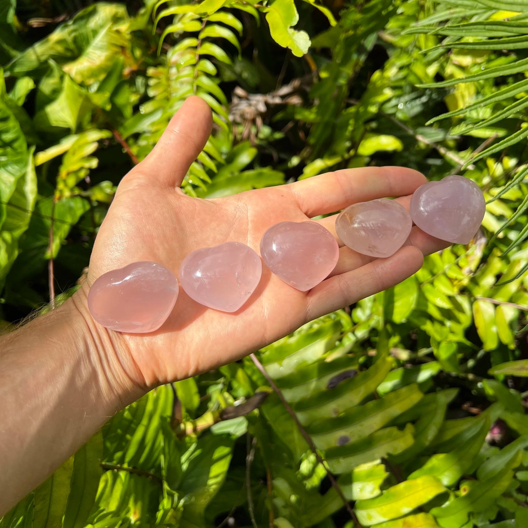Detail shot of Grade AA Rose Quartz heart under natural light