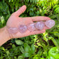 Studio-style view of Rose Quartz stone, linked to Love, shown for size reference.