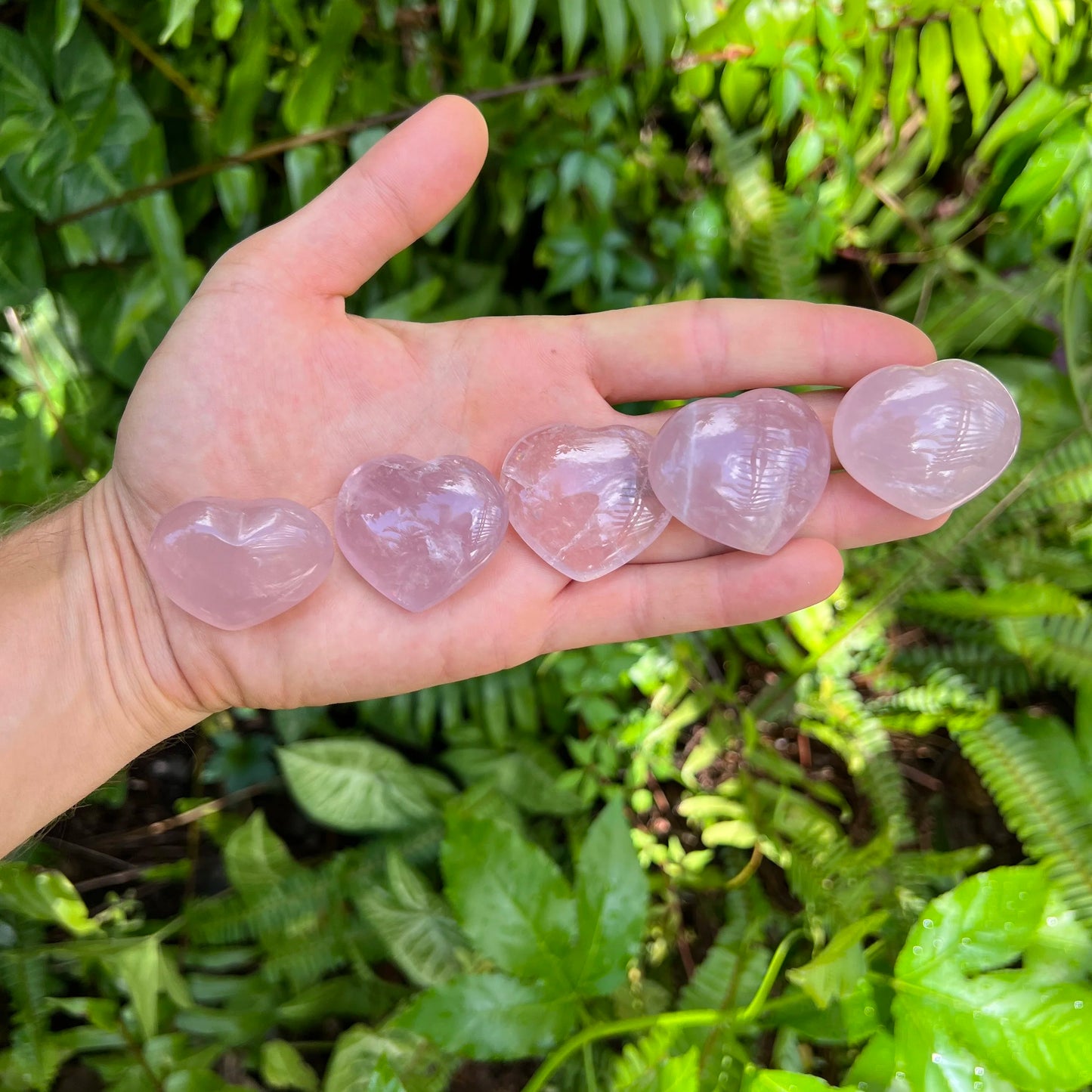 Studio-style view of Rose Quartz stone, linked to Love, shown for size reference.