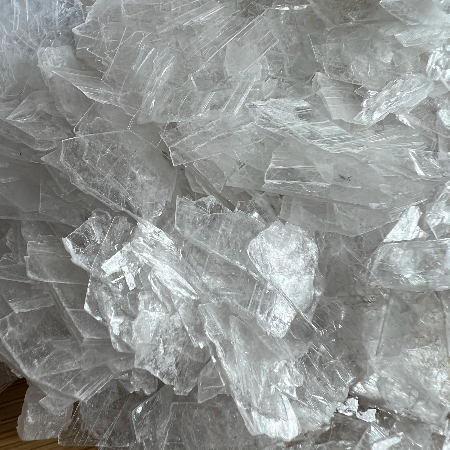 Reverse angle of Selenite polished chip, sourced from United States.