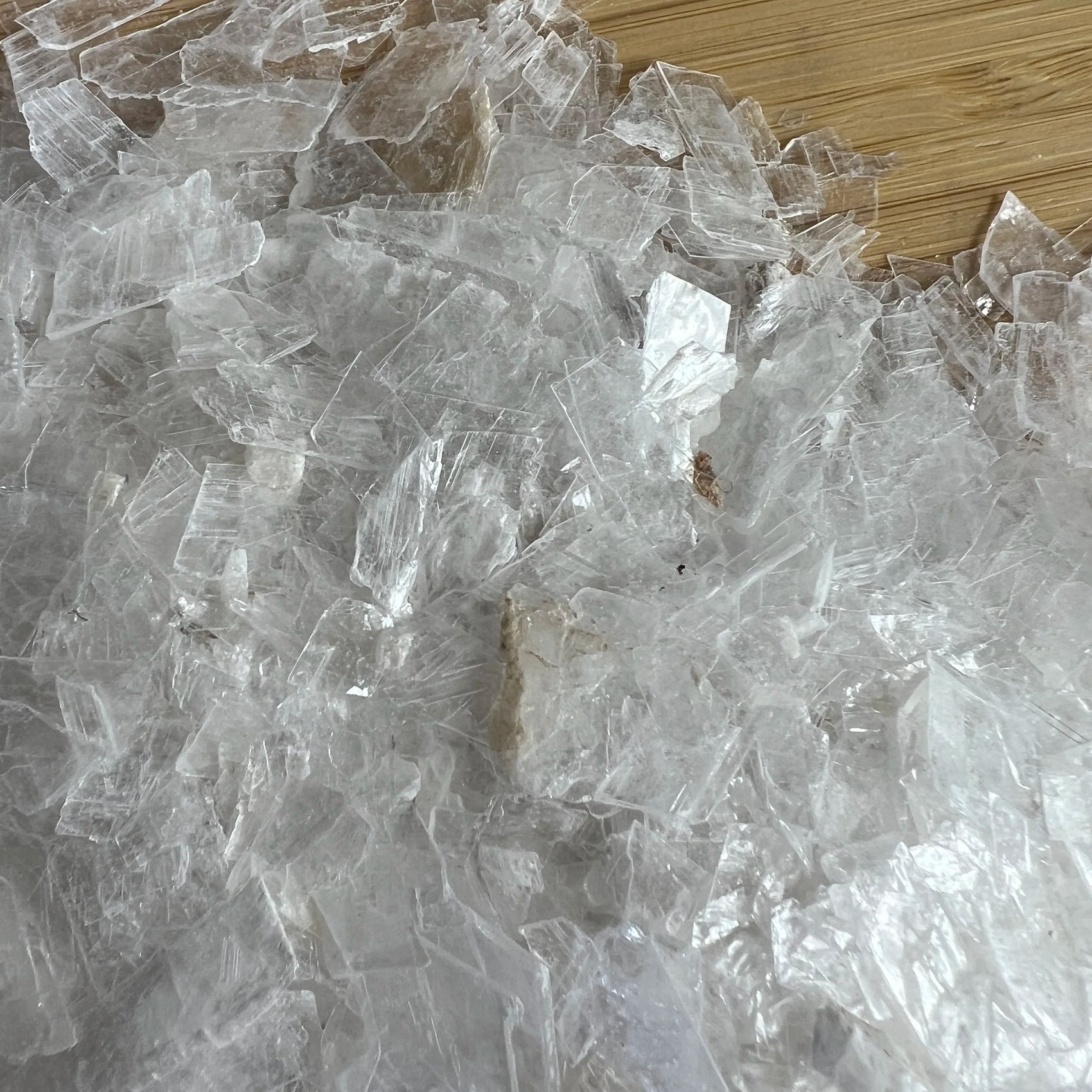 Back view of Grade AAA Selenite crystal chips showing natural surface