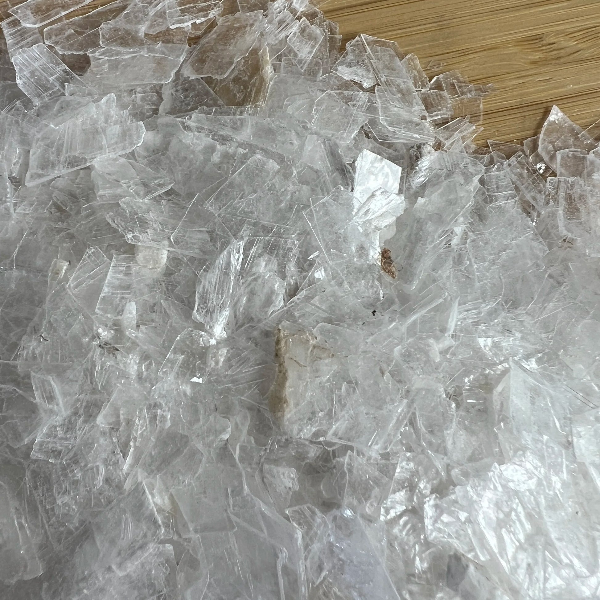 Back view of Grade AAA Selenite crystal chips showing natural surface