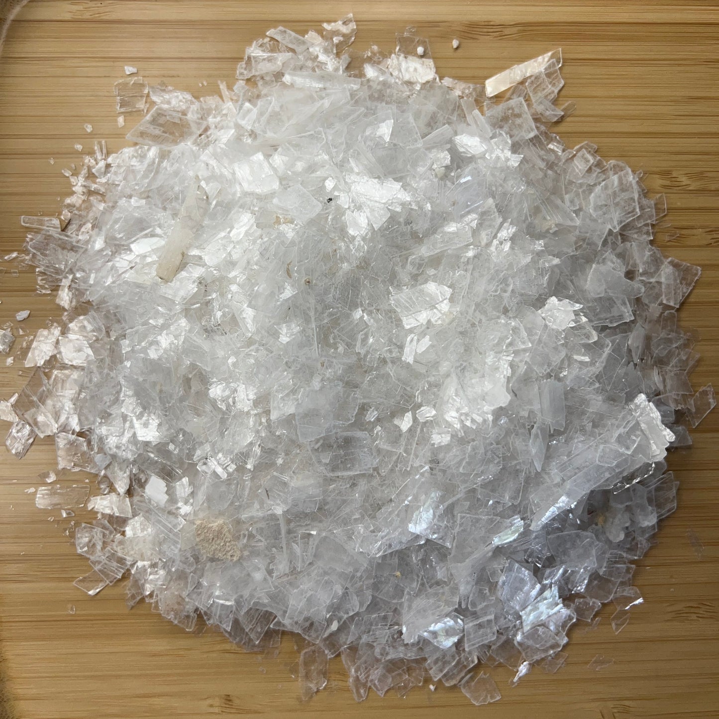 Grain detail of Selenite polished chip, kept close for Cleansing, from New Mexico, USA.