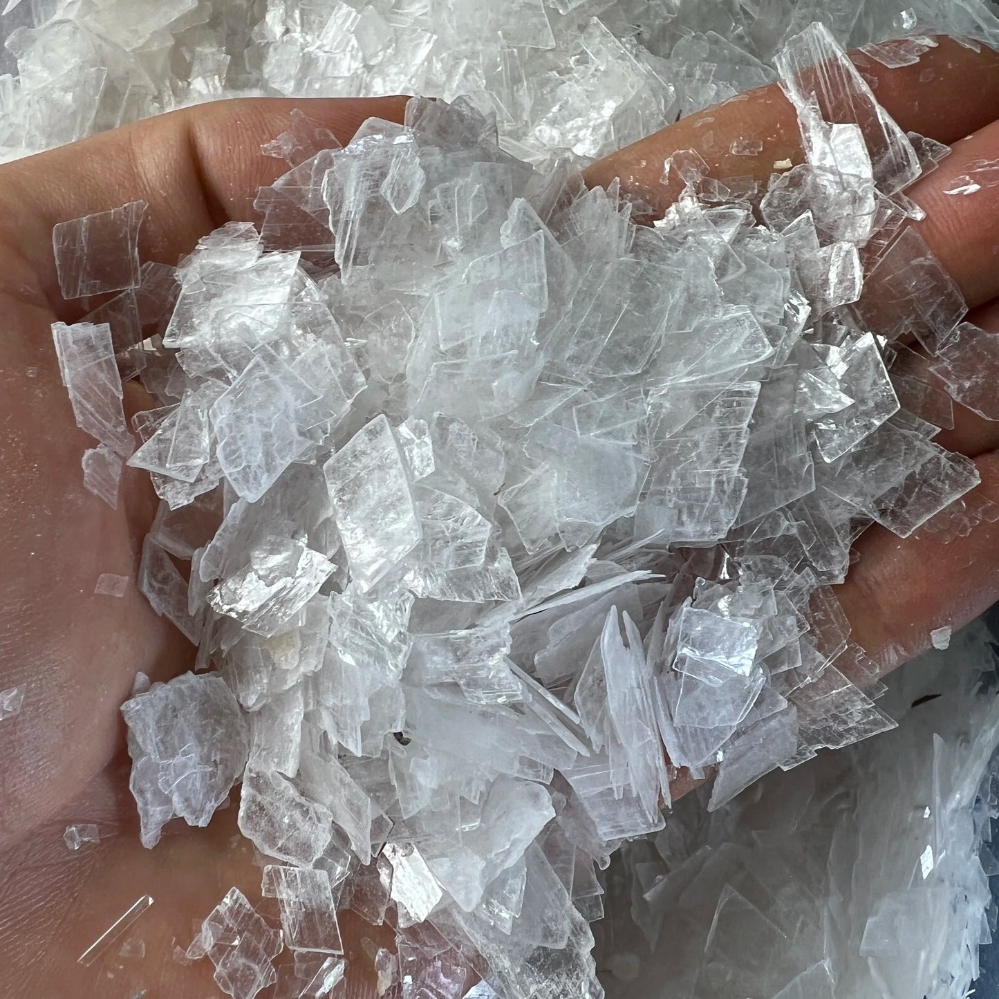 Overhead angle of Selenite polished chip, United States-sourced, kept near for Cleansing and Meditation.