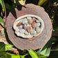 Base detail of Grade AA Crazy Lace Agate tumbled stone