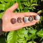 Alternate angle of Grade AA Crazy Lace Agate tumbled stone showing overall shape