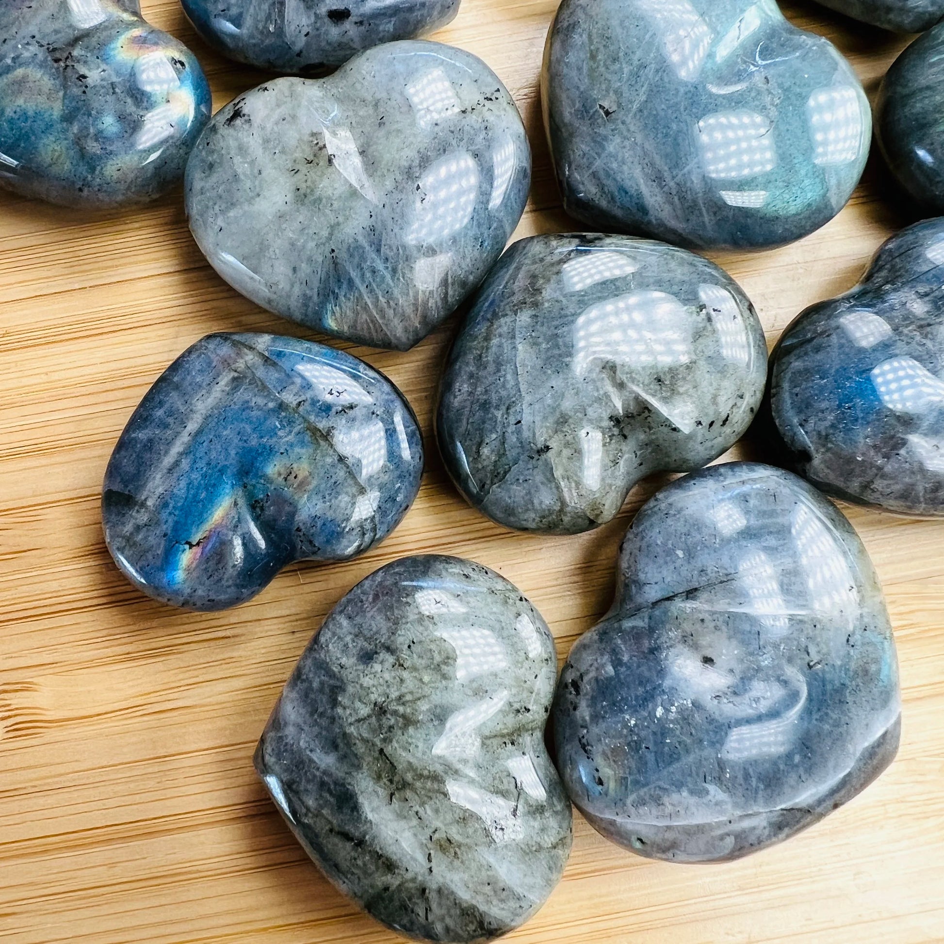 Close-up of Labradorite polished heart, showing color depth, for Intuition.