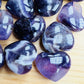 Bird's-eye view of Amethyst polished heart, showing translucent edges.