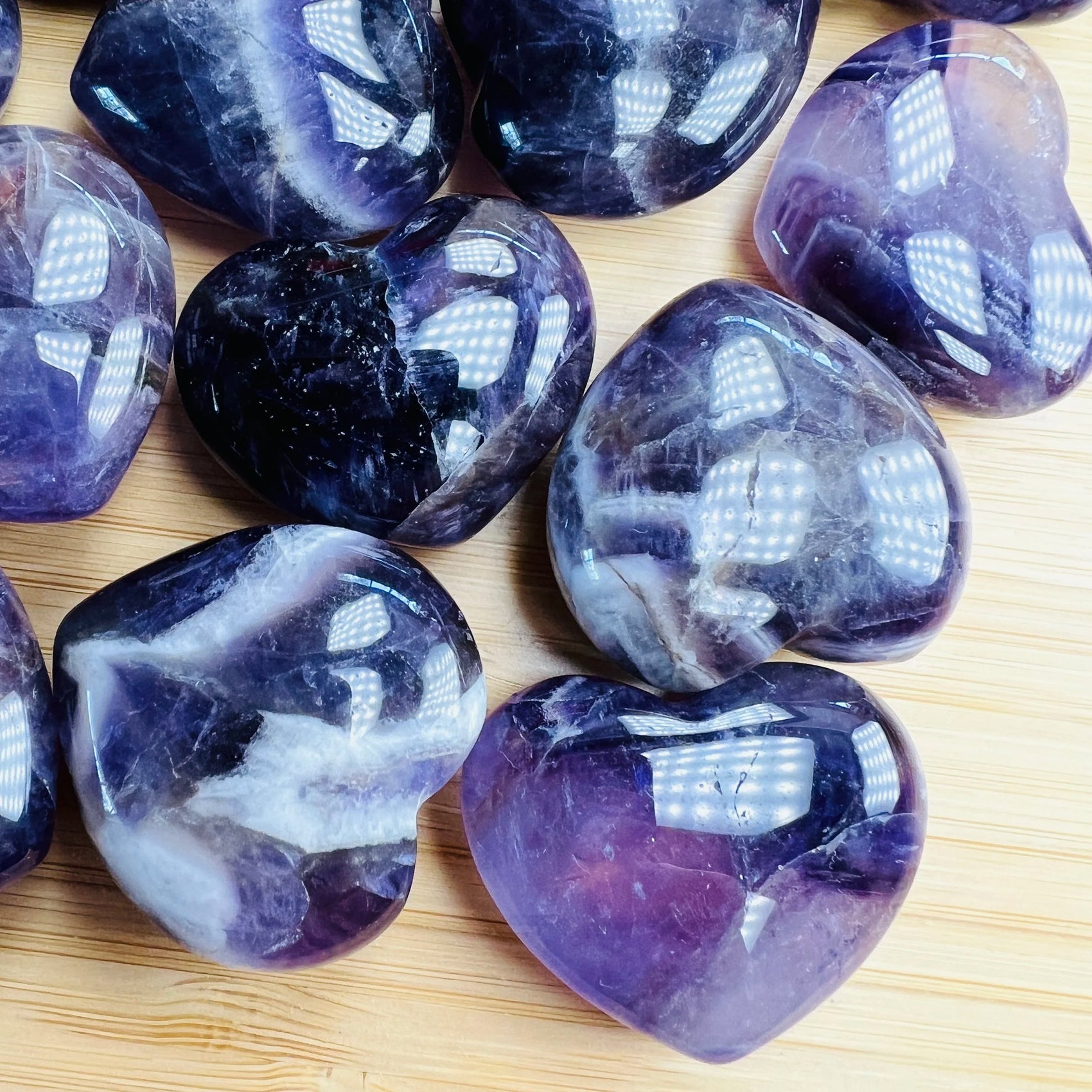 Bird's-eye view of Amethyst polished heart, showing translucent edges.
